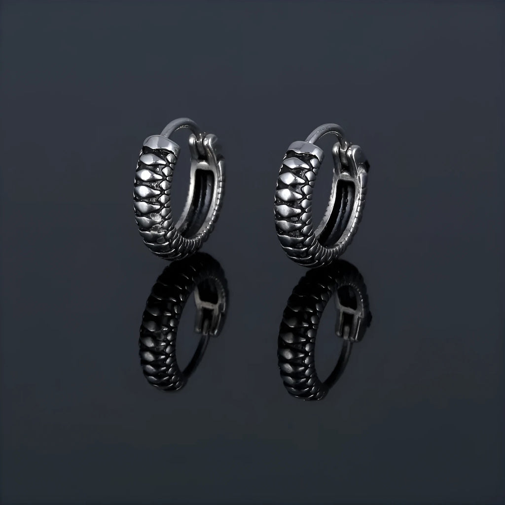 Silver geometric stud earrings with a retro striped twist pattern, made from titanium steel.