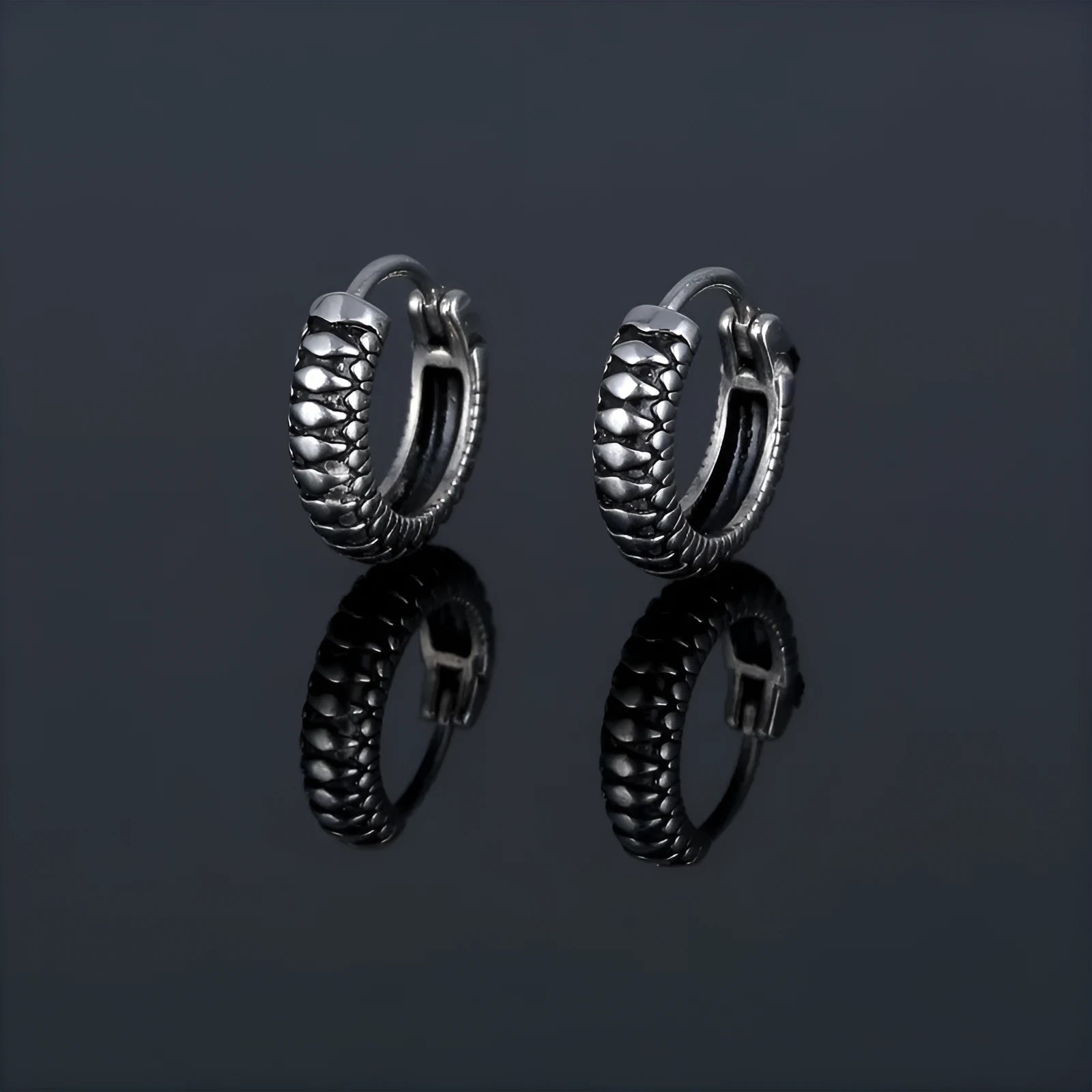 Silver geometric stud earrings with a retro striped twist pattern, made from titanium steel.