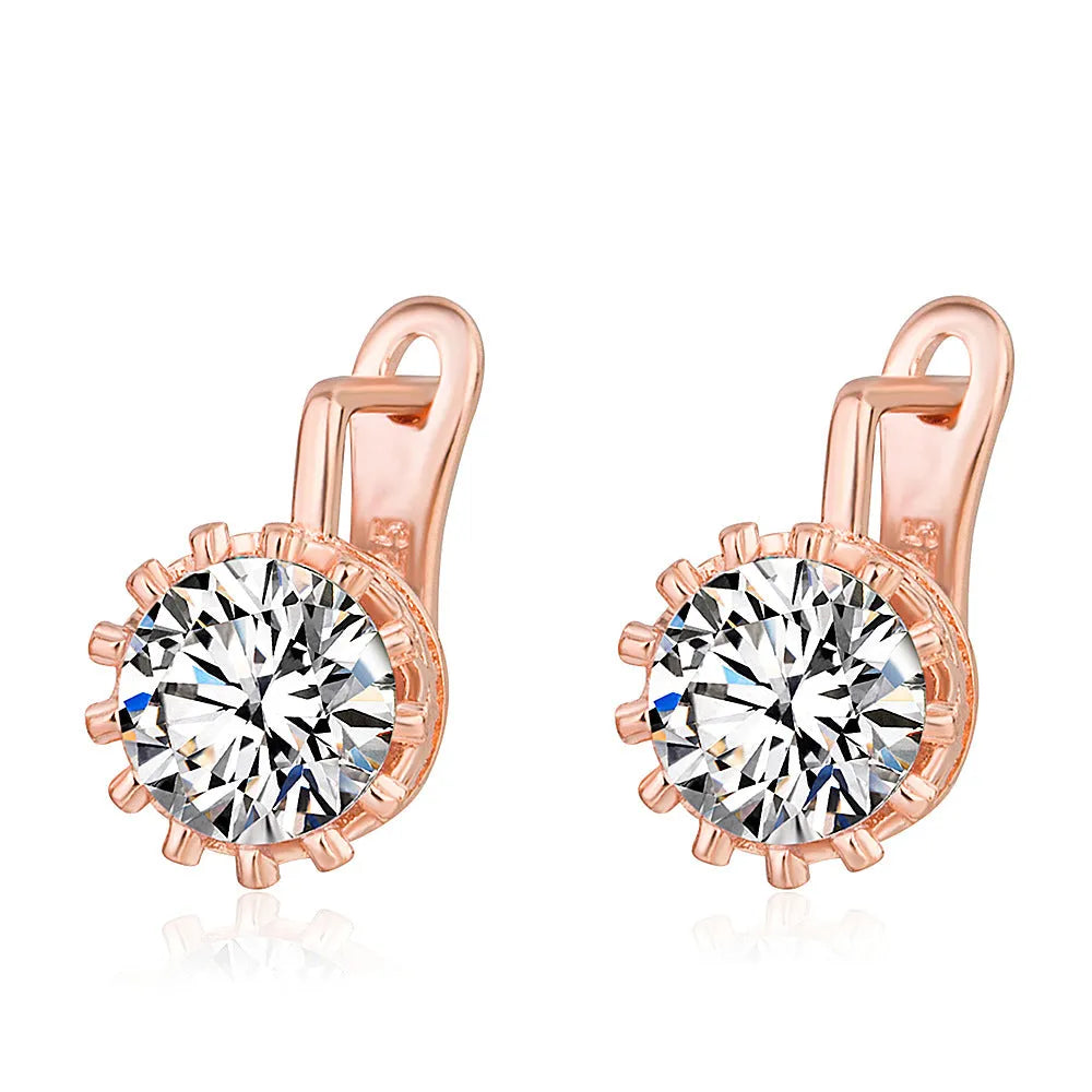 A pair of crown-shaped clip-on earrings for women in a rose gold or white gold colour finish.