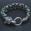 Handmade titanium steel wolf head bracelet in camouflage colour showing polished finish and detailed animal design.