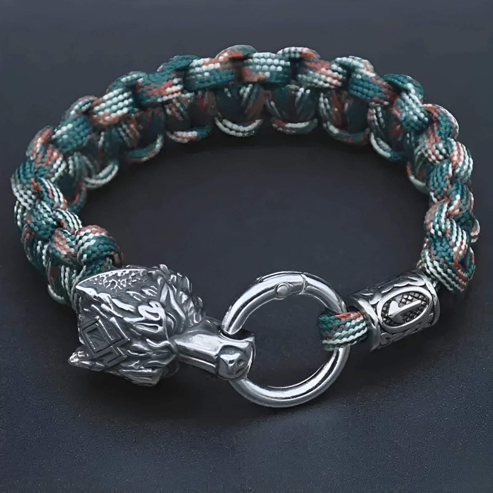 Handmade titanium steel wolf head bracelet in camouflage colour showing polished finish and detailed animal design.