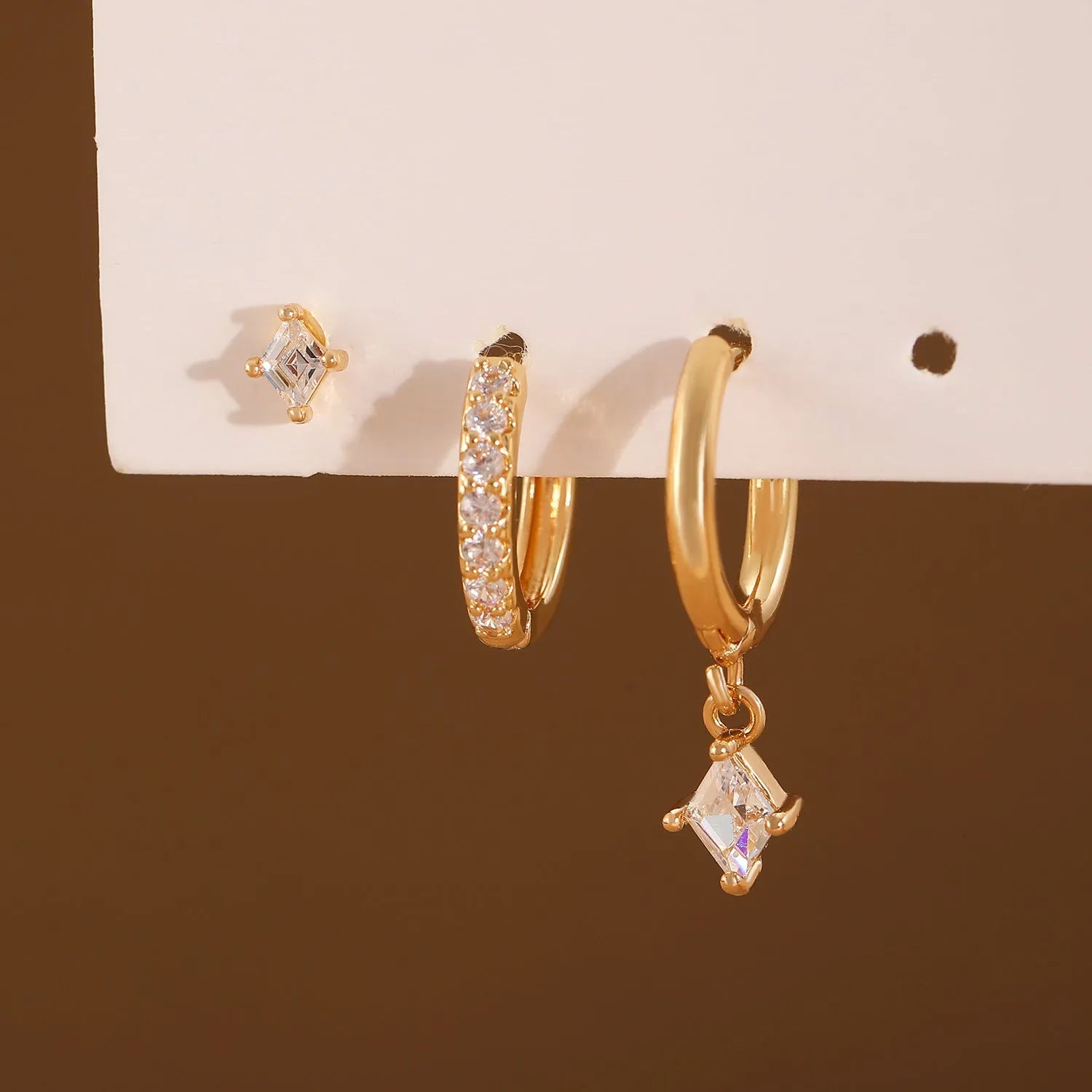 Three-piece ladies earring set with geometric zircon designs in gold and white copper jewellery