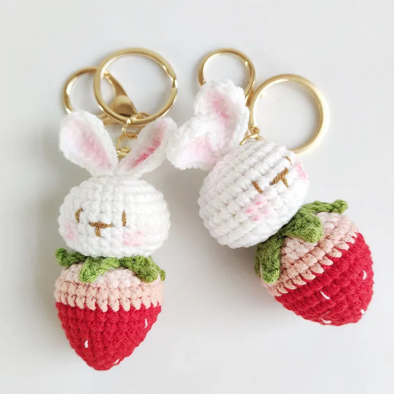 White hand-woven rabbit strawberry pendant on key with cartoon-style wire construction