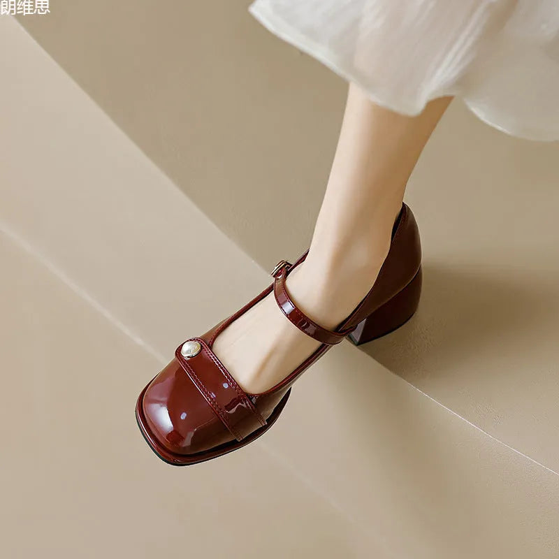French style chunky heel hiking pump in patent leather with square toe and buckle closure