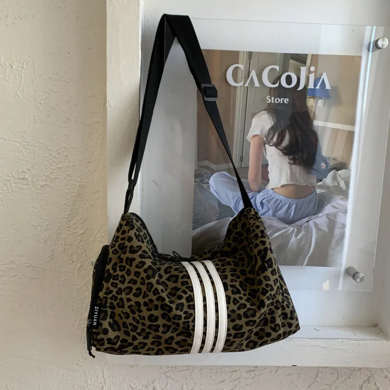 Large capacity leopard print cross-body messenger bag with shoulder strap