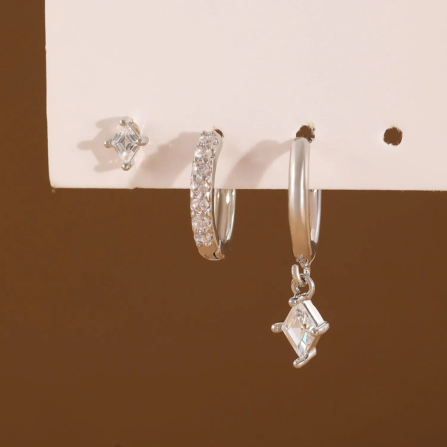 Three-piece ladies earring set with geometric zircon designs in gold and white copper jewellery