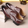 Men's black houndstooth plaid casual shoes with square toe and lace-up front on a rubber sole.