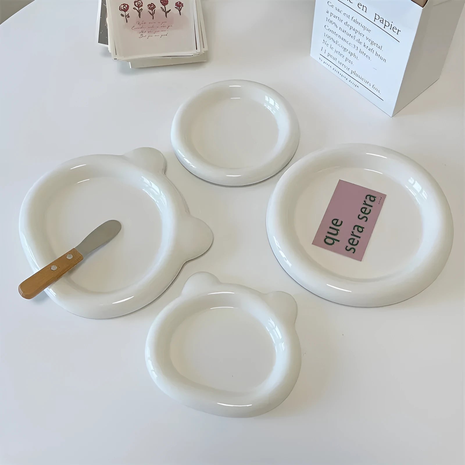 White porcelain chubby toot plate with bear doodle design, suitable for microwave use