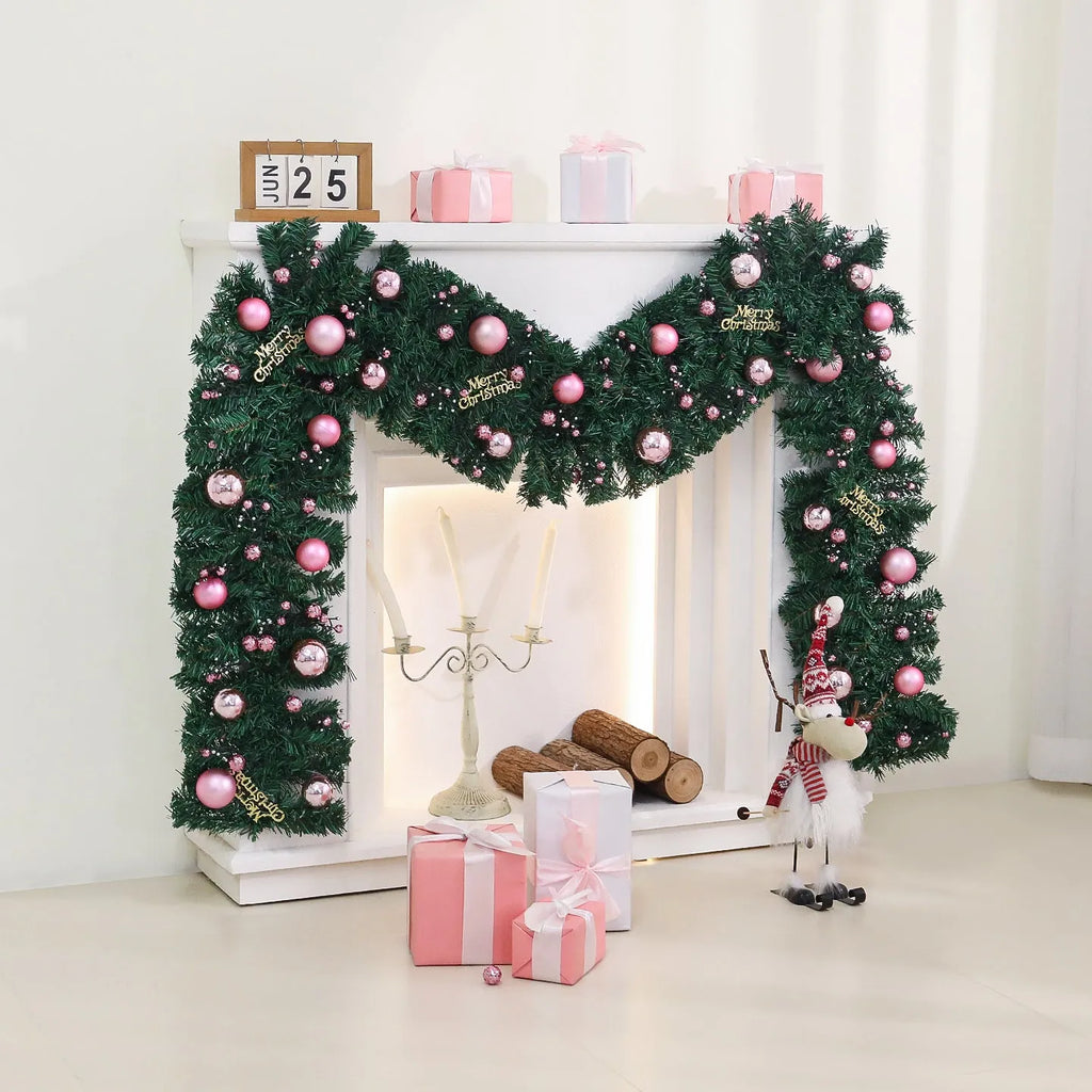 Long pink rattan Christmas garland with small fruit details and optional warm white lights draped on a mantle.