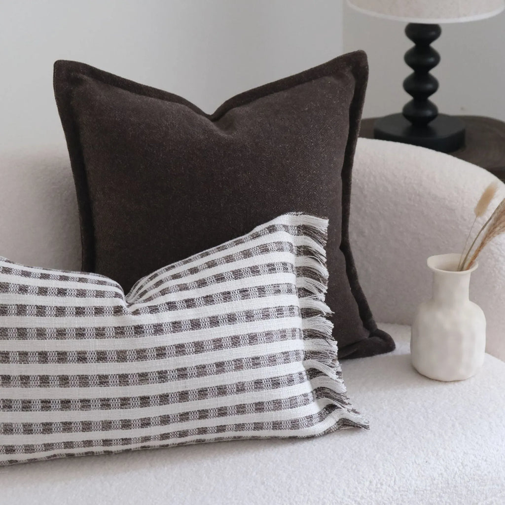 Coffee brown striped Chinese classical style decorative sofa cushion on a grey sofa.