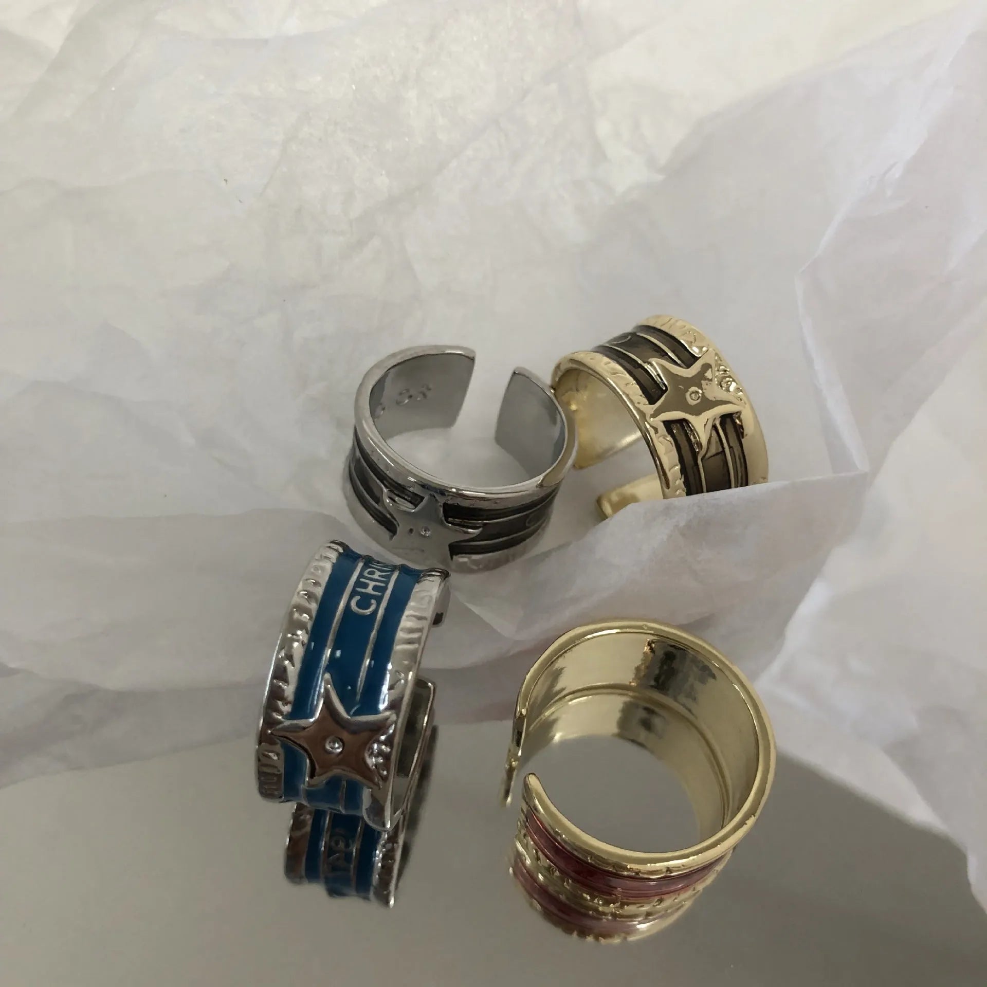 Geometric drop ring with distressed finish and adjustable band