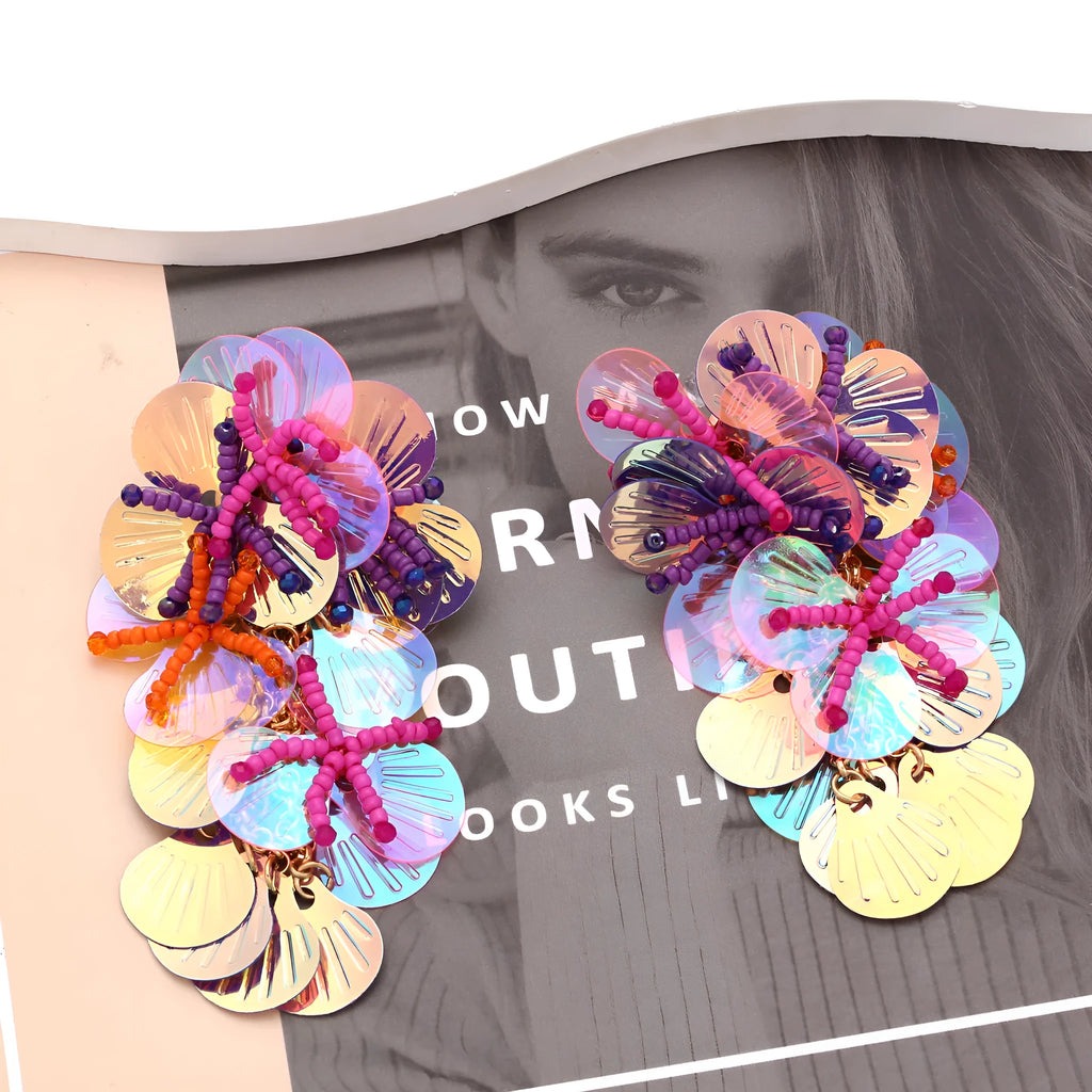 Close-up of colourful handmade bead flower earrings with leaves in European exaggerated style.