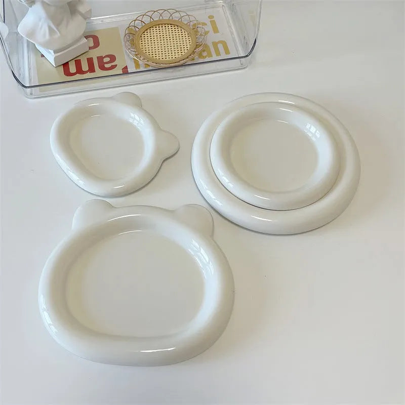White porcelain chubby toot plate with bear doodle design, suitable for microwave use