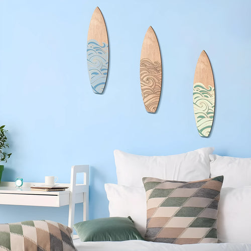 Three wooden surfboard-shaped wall decorations in boxwood with European style design
