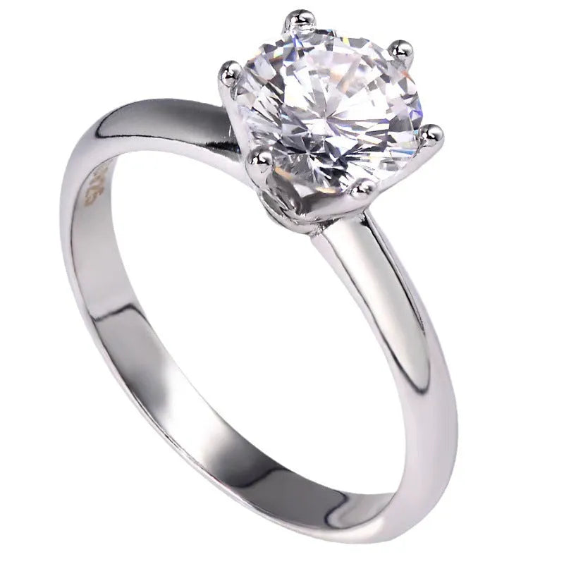 White gold plated zircon ring with six-claw geometric setting on white copper base