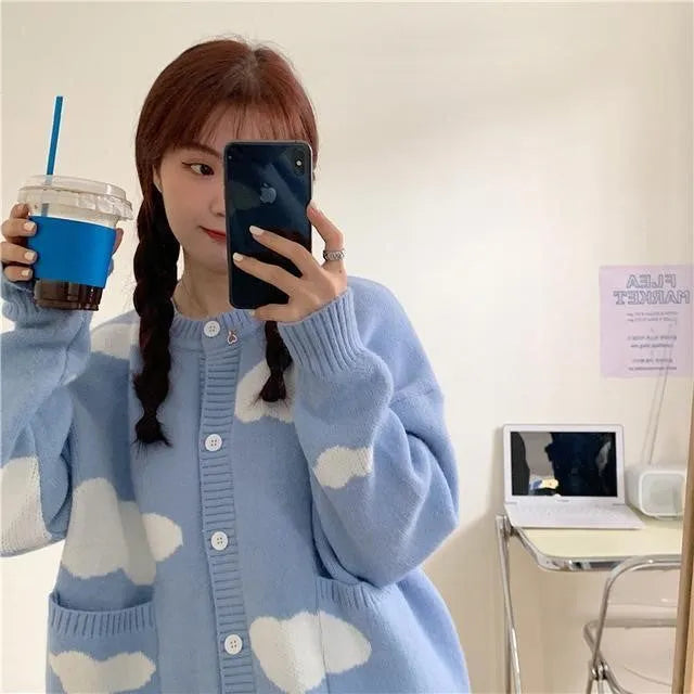 Blue cloud pattern women's loose cardigan sweater with long sleeves on hanger