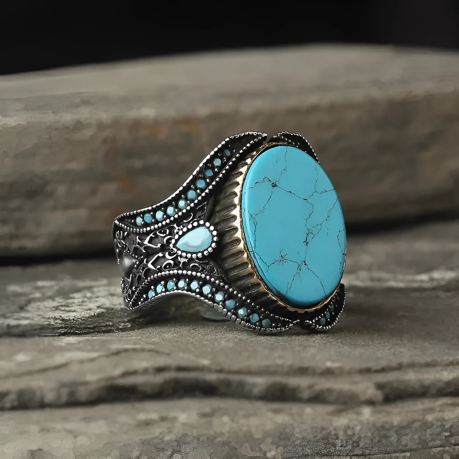Men's round turquoise ring with antique silver finish showing circular alloy band design