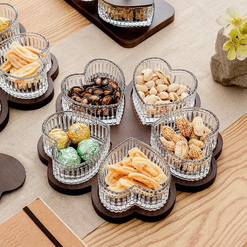 Glass retro-style snack platter with coloured glaze and a transparent heart-shaped lid over multiple compartments.