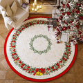 Round red Christmas carpet with festive pattern on wooden floor