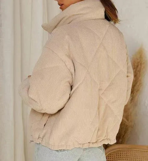 Women's apricot corduroy jacket with wadded quilting, stand collar, and zip-front closure