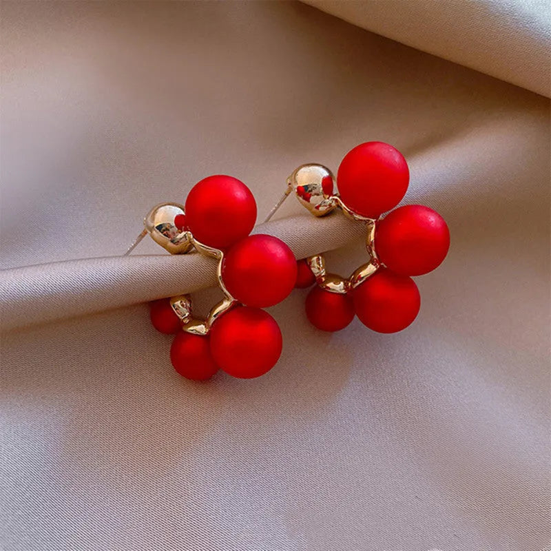 Red alloy bell earrings with decorative charm for women