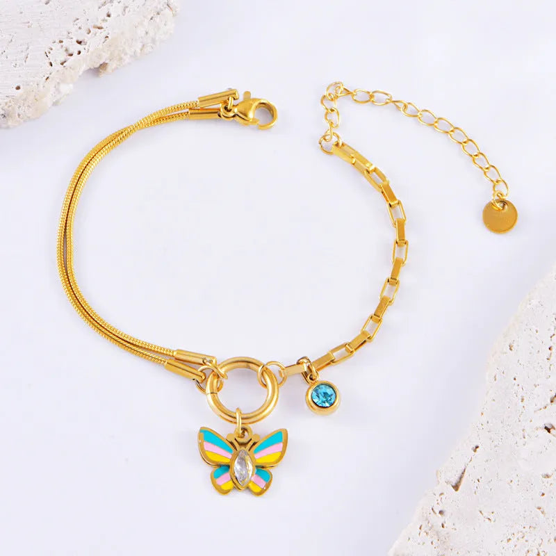 Gold titanium steel butterfly jewellery set with necklace and bracelet on snake bone chains