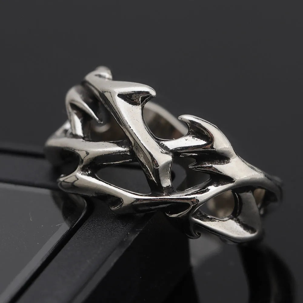 Adjustable copper men's ring with geometric thorn and flower design showing opening mechanism