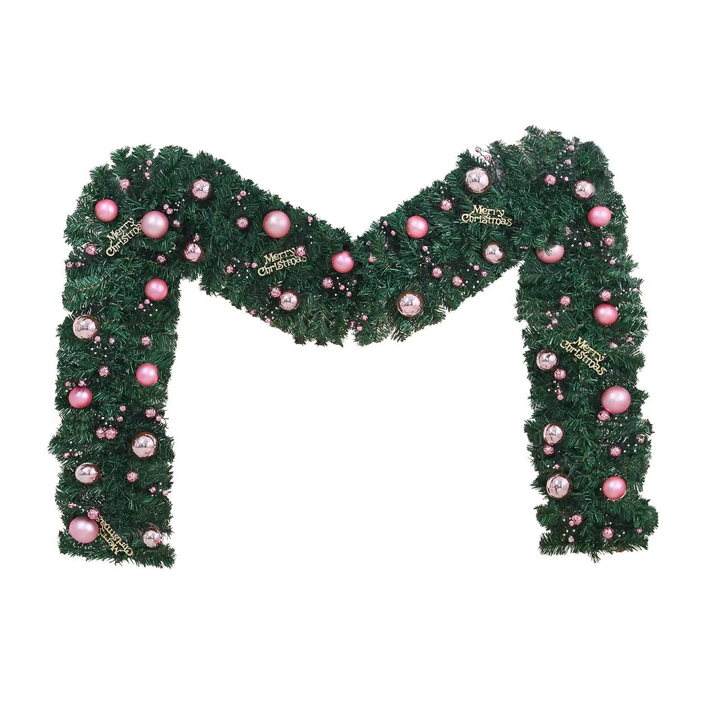Long pink rattan Christmas garland with small fruit details and optional warm white lights draped on a mantle.