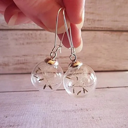 Transparent 16mm glass ball earrings with dandelion seed crystal design on silver French hooks