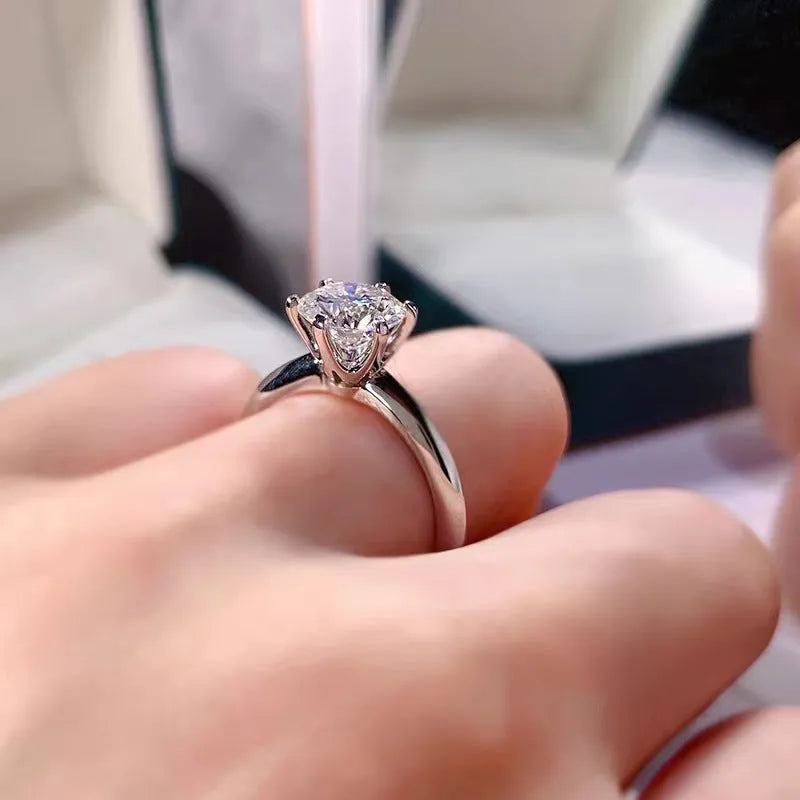 White gold plated zircon ring with six-claw geometric setting on white copper base