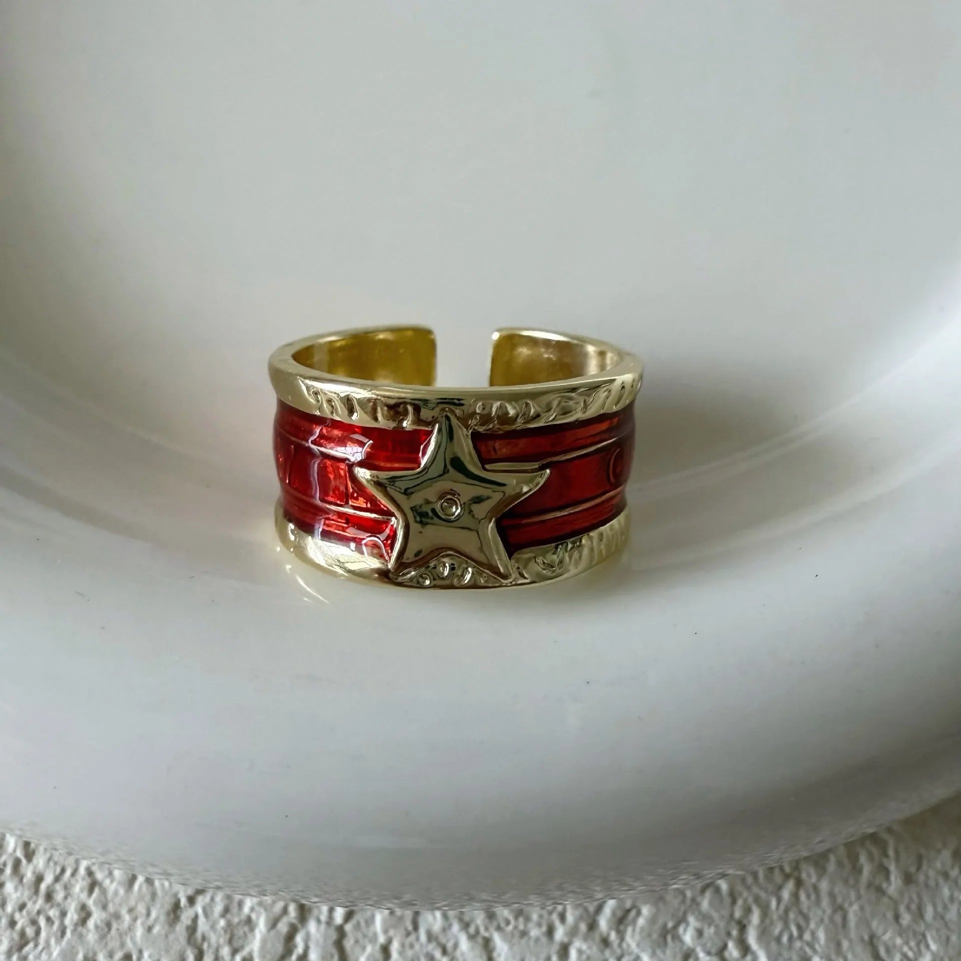 Geometric drop ring with distressed finish and adjustable band