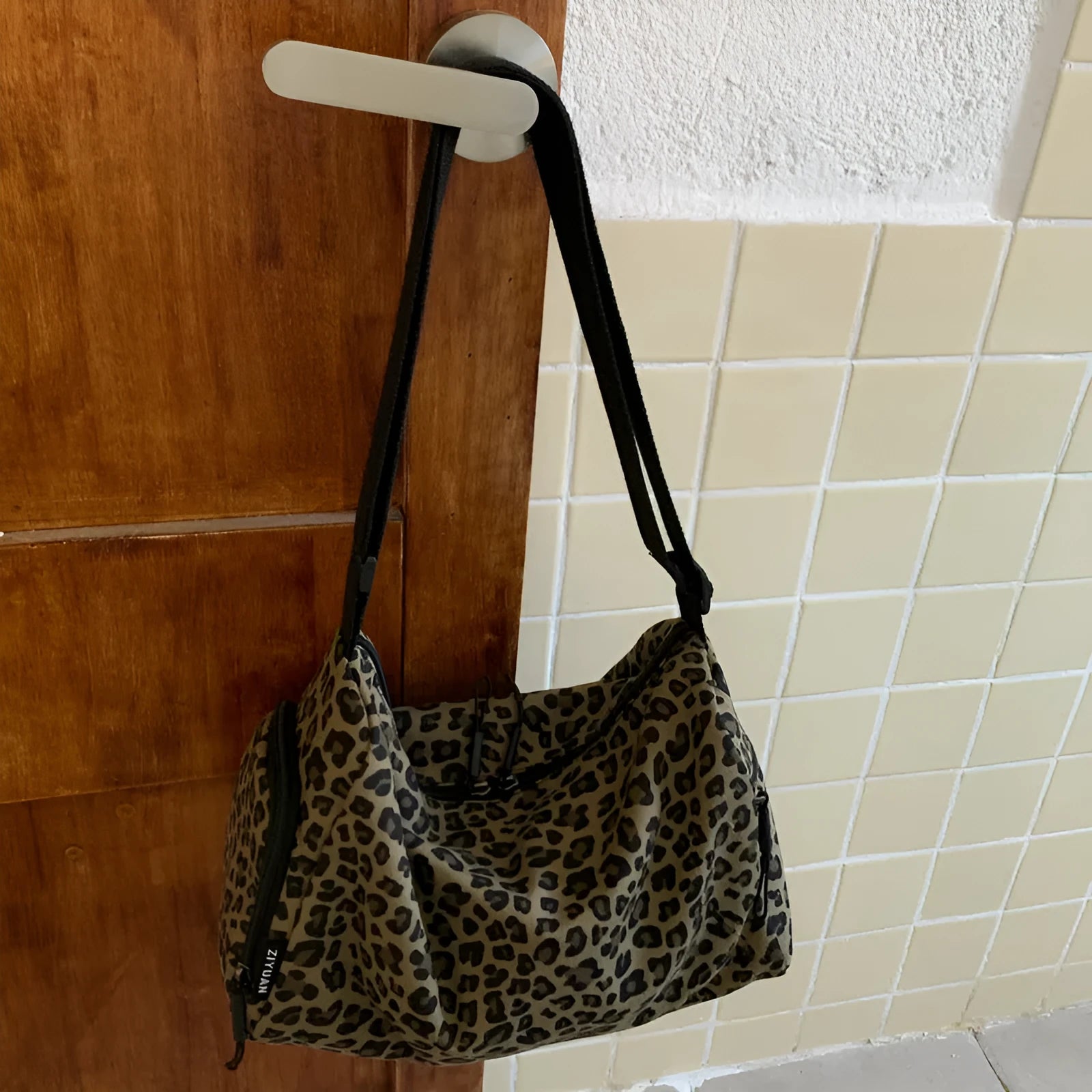 Large capacity leopard print cross-body messenger bag with shoulder strap