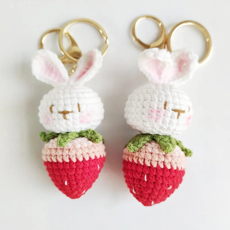 White hand-woven rabbit strawberry pendant on key with cartoon-style wire construction