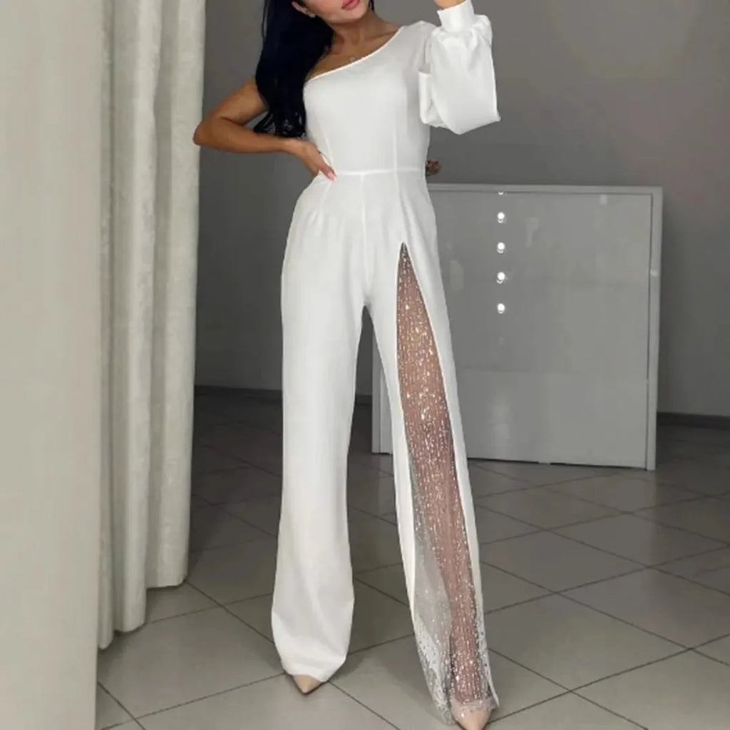 Black women's jumpsuit with one shoulder cut and high leg slit, made from polyester fabric.