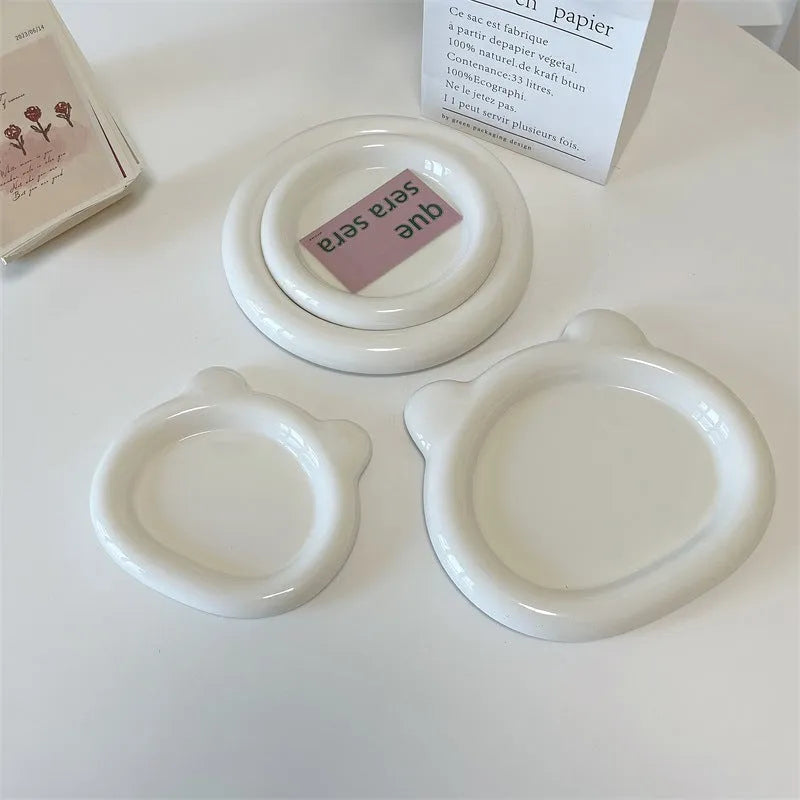 White porcelain chubby toot plate with bear doodle design, suitable for microwave use