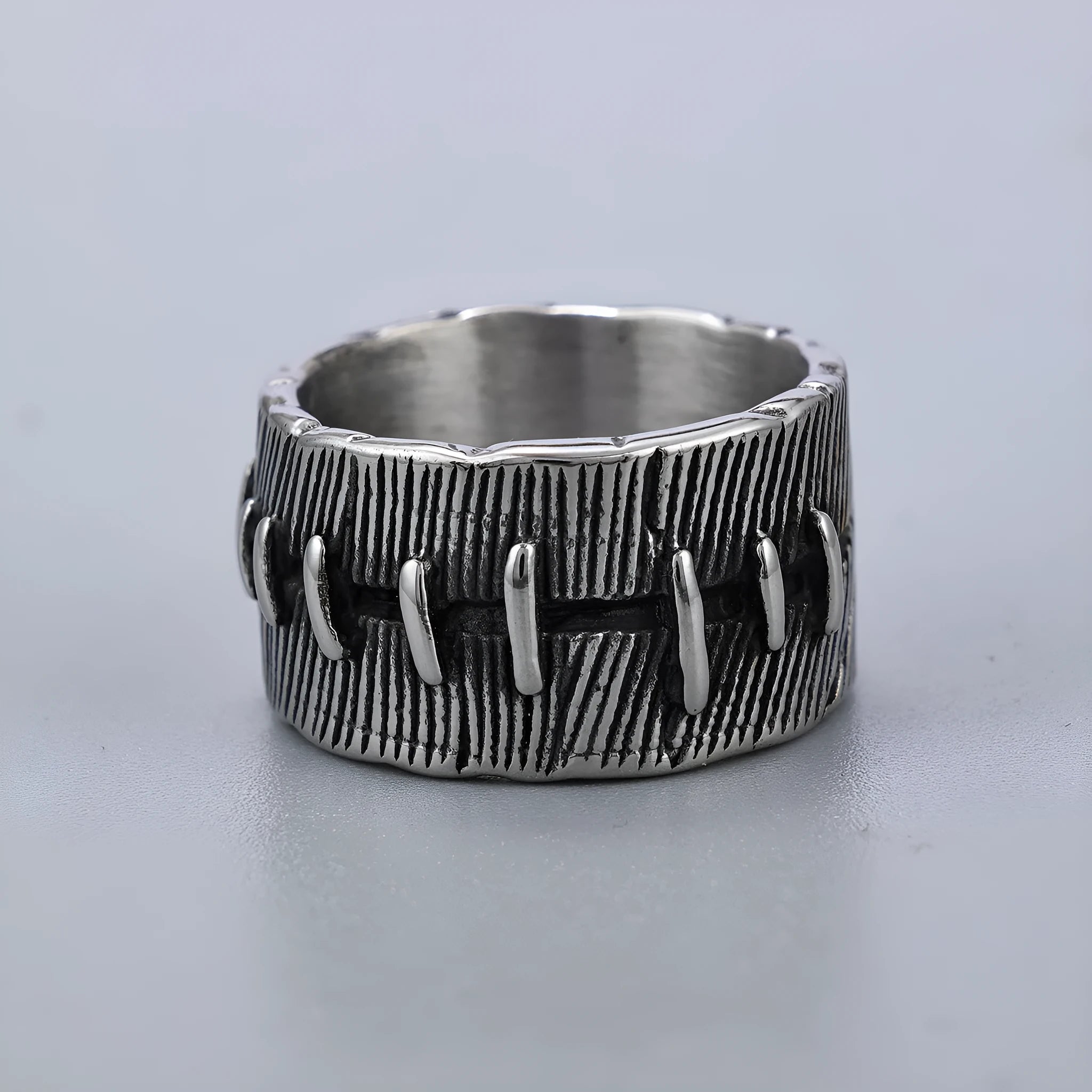 Dark punk geometric ring with double ring design and stitched detailing in retro colour on titanium steel