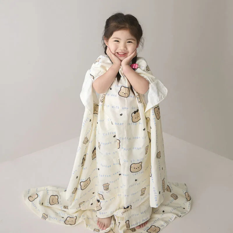 Anti-kick sleeping bag blanket in a summer design on a bed, showing its lightweight texture.