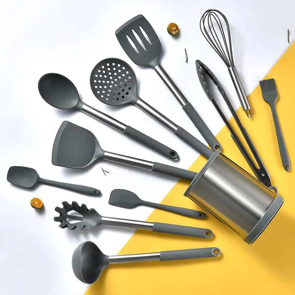 Black silicone 12-piece kitchen utensil set with rotating storage bucket including ladle, spatula, and food clip.