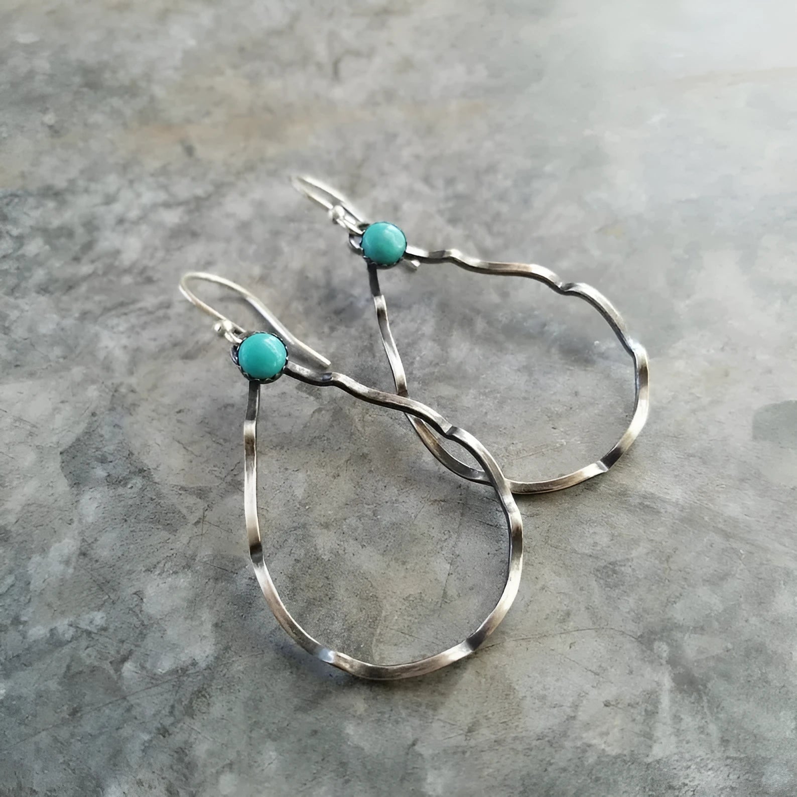 Bohemian style geometric circle earrings with turquoise accents in antique silver finish