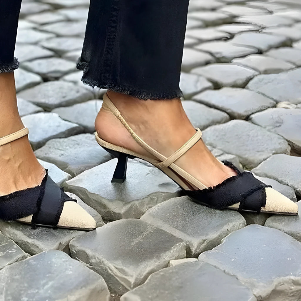 Apricot and black colour block women's stiletto heel sandals with pointed toe and buckle strap.