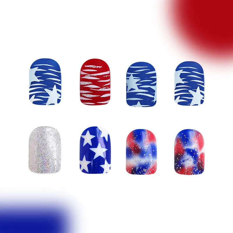 Box of finished glitter red and blue multicolor Independence Day nail tips in a short European Square shape.