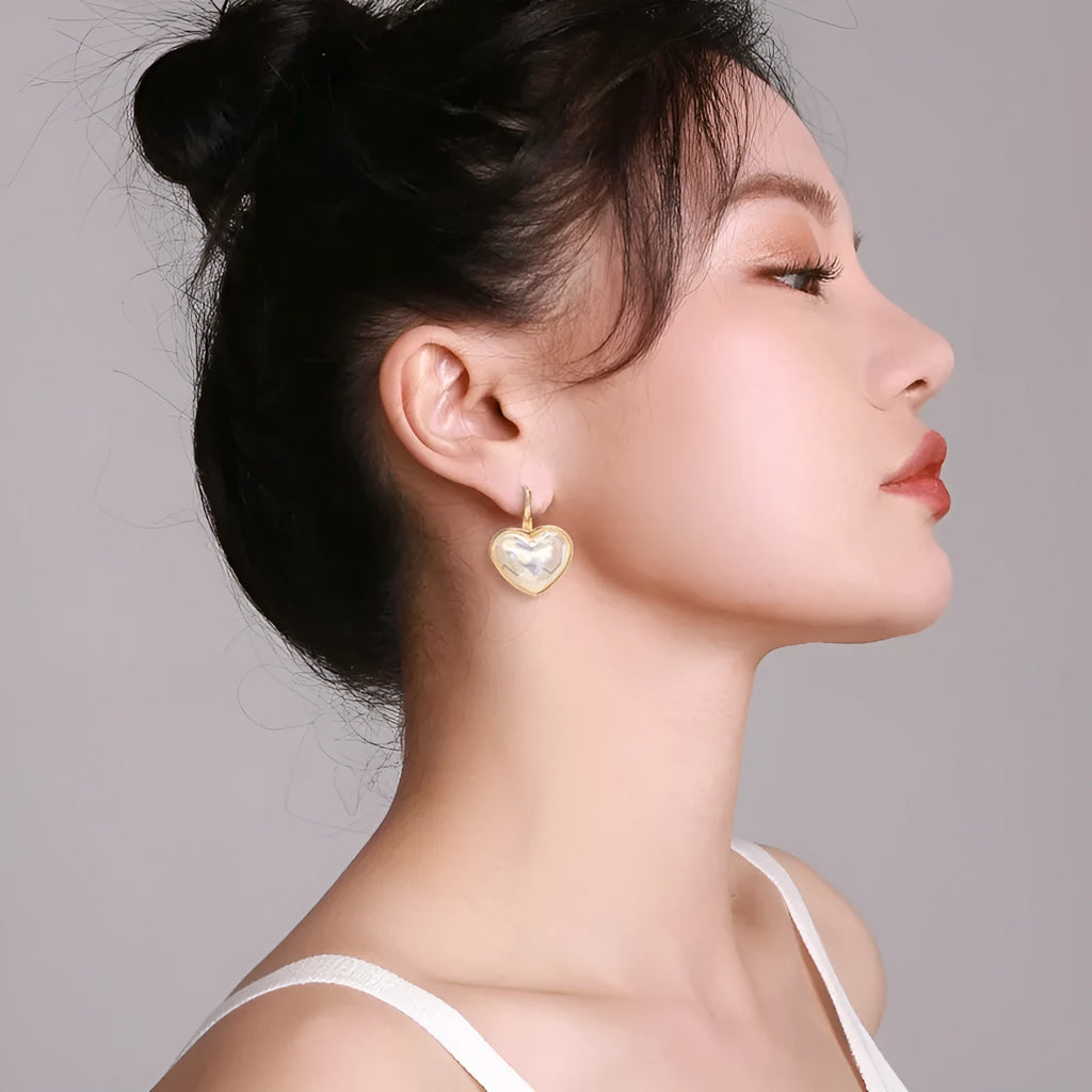 Gold-coloured clip-on earrings with natural style design for women