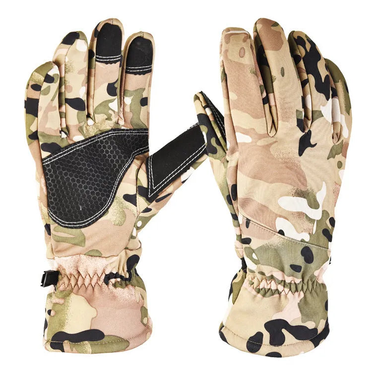 A pair of tactical camouflage ski gloves with touch-screen fingertips on a winter background.