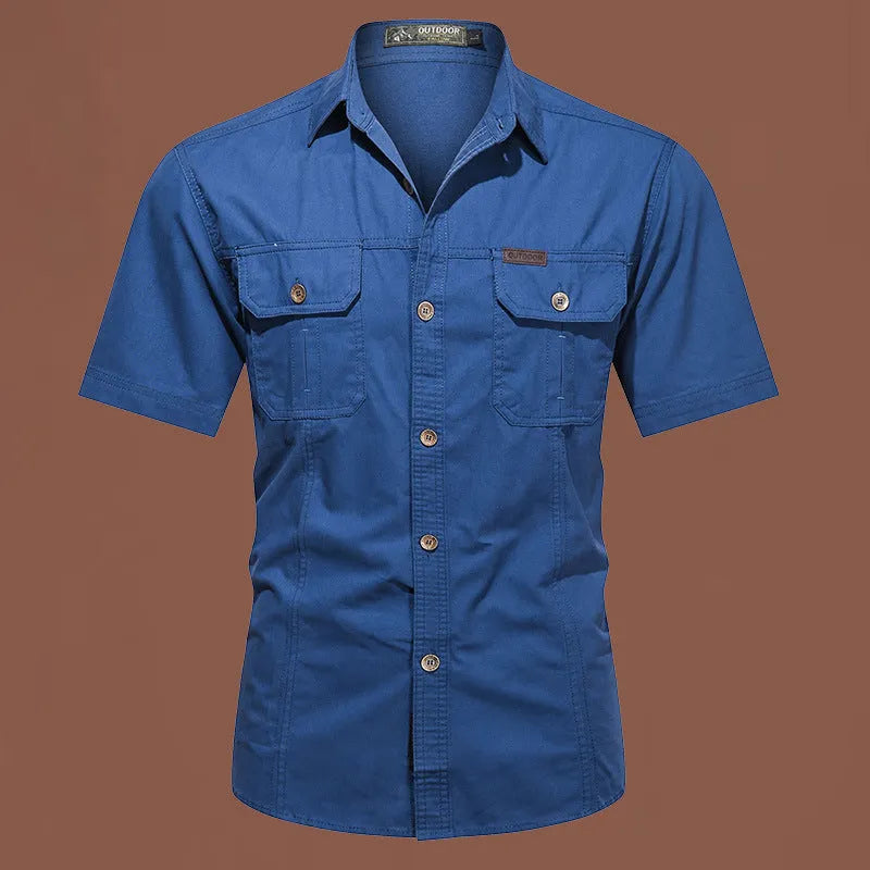 Men's loose-fitting short sleeve cotton work shirt in army green, laid flat.