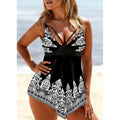 Plus size women's swimsuit with deep V-neck and printed strappy design in blue.