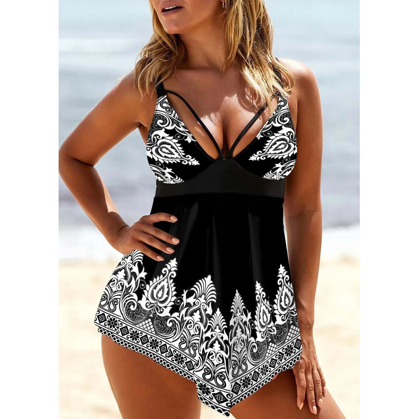 Plus size women's swimsuit with deep V-neck and printed strappy design in blue.