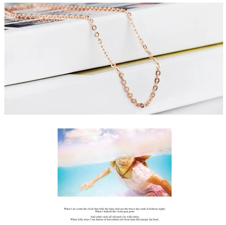 Women's heart-shaped artificial crystal pendant on rose gold electroplated cross chain necklace
