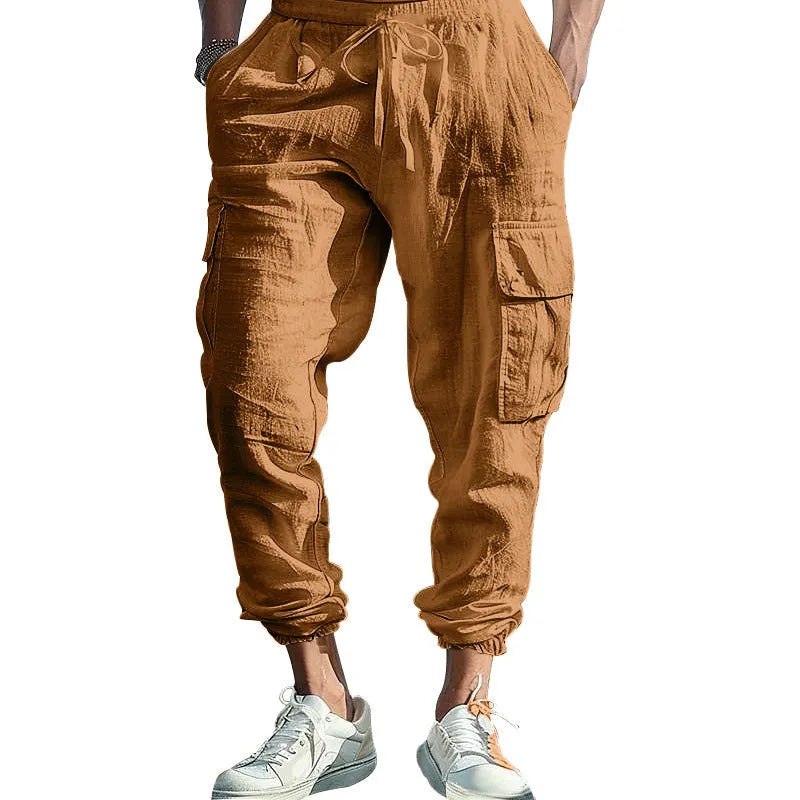 Men's solid colour linen casual trousers with ankle-tied cuffs, multiple pockets, and a drawstring waist