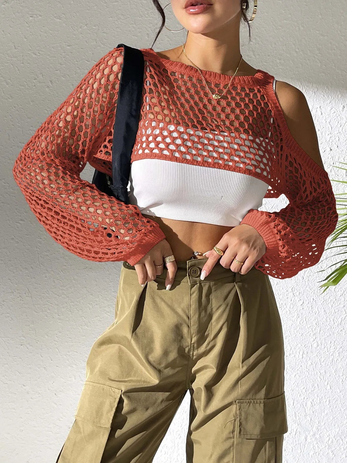 Mesh shirt with a navel cutout design in a free size, shown in one of six available colours.