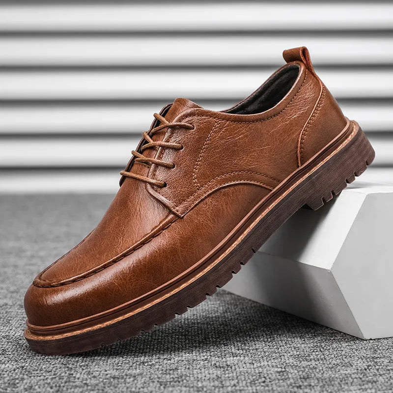 Casual leather shoes in black with round toe, low top design, and visible sewing line detailing